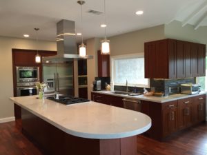 Custom kitchen with recessed and pendant lighting